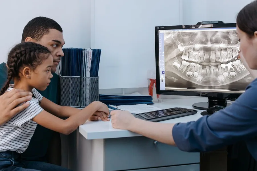 Father and daughter reviewing an x-ray with their Fort Myers dentist